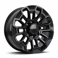 Black alloy wheel with a complex geometric spoke design and a central hubcap